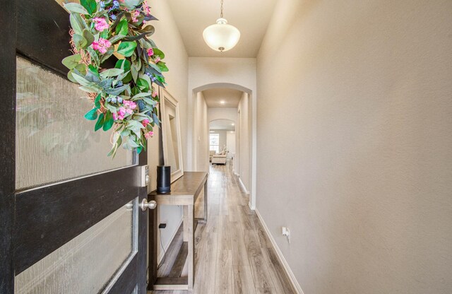 15023 Eves Necklace Ct, Cypress, TX 77433 - hall with arched walkways and wood finished floors