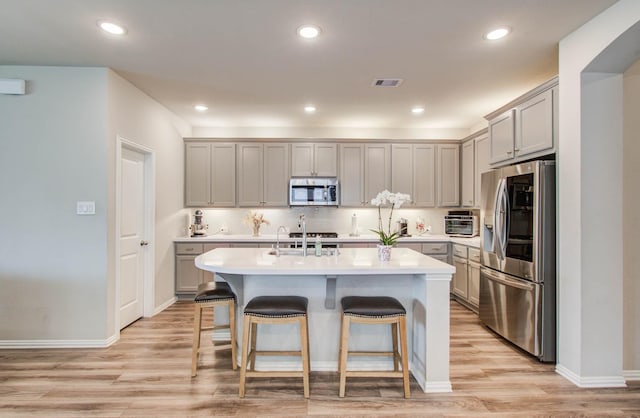 15023 Eves Necklace Ct, Cypress, TX 77433 - kitchen with stainless steel appliances, gray cabinetry, light countertops, and recessed lighting
