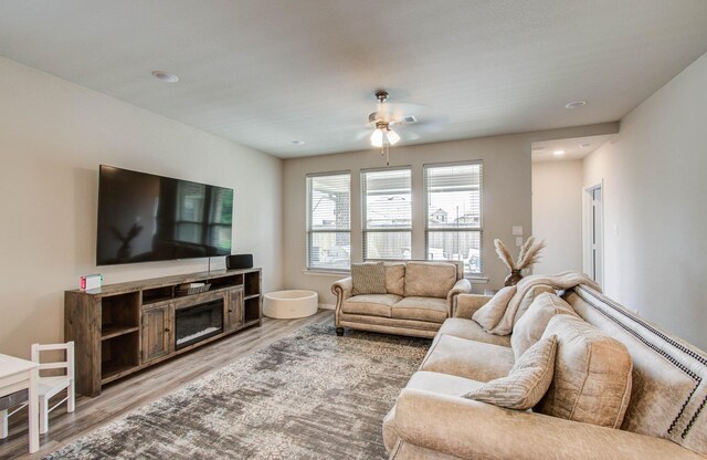15023 Eves Necklace Ct, Cypress, TX 77433 - living area featuring ceiling fan, light wood-type flooring, recessed lighting, and a fireplace