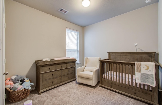 15023 Eves Necklace Ct, Cypress, TX 77433 - bedroom with light carpet and a crib