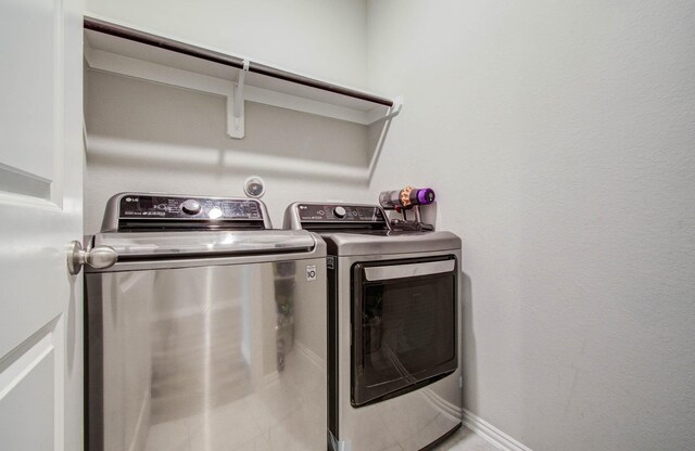15023 Eves Necklace Ct, Cypress, TX 77433 - laundry room with washer and dryer and baseboards