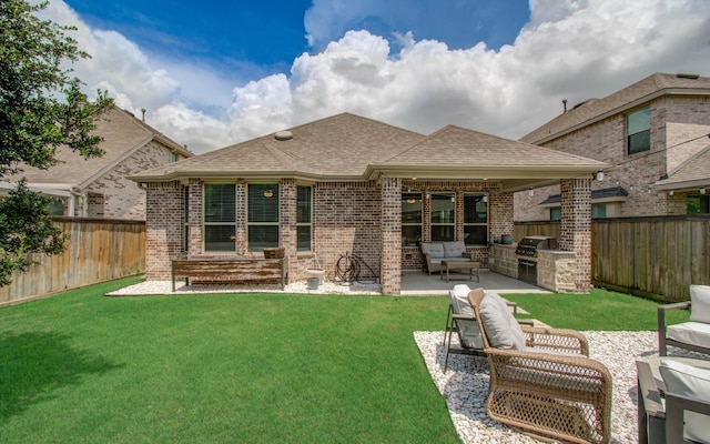 15023 Eves Necklace Ct, Cypress, TX 77433 - rear view of property featuring an outdoor kitchen, a fenced backyard, roof with shingles, and a patio