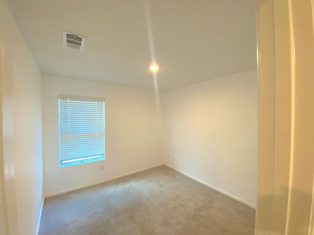21015 Longeni Dr, New Caney, TX 77357 - carpeted spare room featuring baseboards