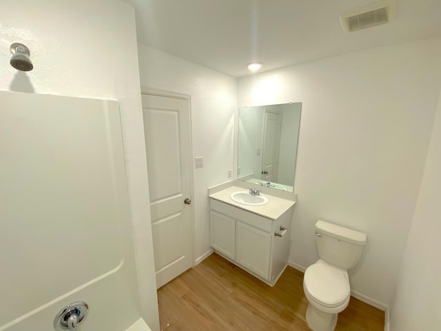 21015 Longeni Dr, New Caney, TX 77357 - bathroom featuring wood finished floors and vanity