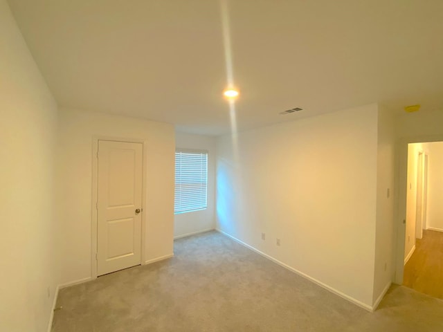 21015 Longeni Dr, New Caney, TX 77357 - unfurnished room featuring light carpet