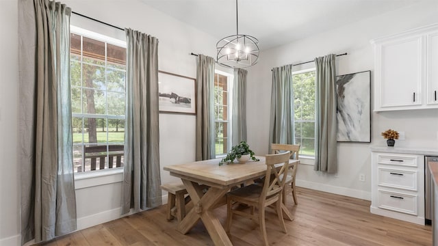 27938 Deer Run St, Montgomery, TX 77356 - dining space with light wood-style floors and a chandelier