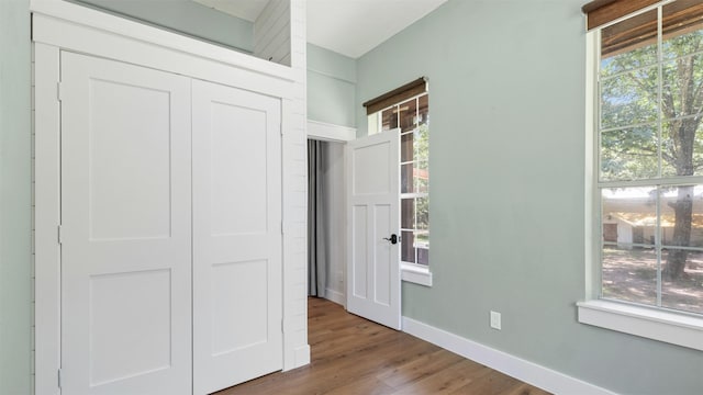27938 Deer Run St, Montgomery, TX 77356 - unfurnished bedroom with wood finished floors and a closet