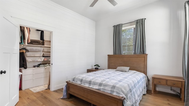 27938 Deer Run St, Montgomery, TX 77356 - bedroom featuring light wood finished floors, a closet, ceiling fan, and a walk in closet