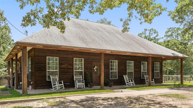 27938 Deer Run St, Montgomery, TX 77356 - rear view of house featuring a porch and a shingled roof