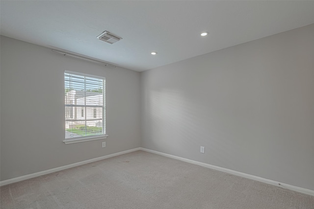 1101 Saulnier St, Houston, TX 77019 - spare room with light carpet and recessed lighting