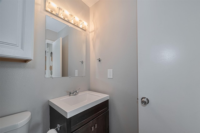 1101 Saulnier St, Houston, TX 77019 - half bathroom with vanity and toilet
