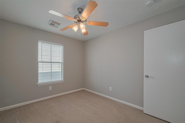 1101 Saulnier St, Houston, TX 77019 - empty room featuring light carpet, a smoke detector, and a ceiling fan