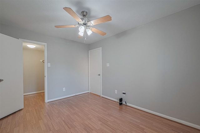 1101 Saulnier St, Houston, TX 77019 - empty room with light wood-style flooring and ceiling fan
