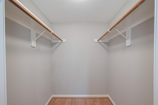 1101 Saulnier St, Houston, TX 77019 - walk in closet featuring light wood-style floors