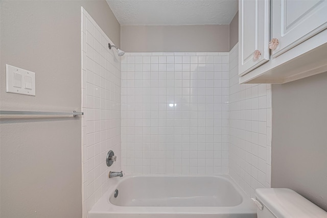 1101 Saulnier St, Houston, TX 77019 - full bathroom with washtub / shower combination and a textured ceiling