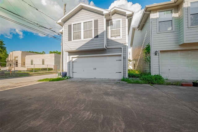 1101 Saulnier St, Houston, TX 77019 - view of front of property featuring a garage and concrete driveway