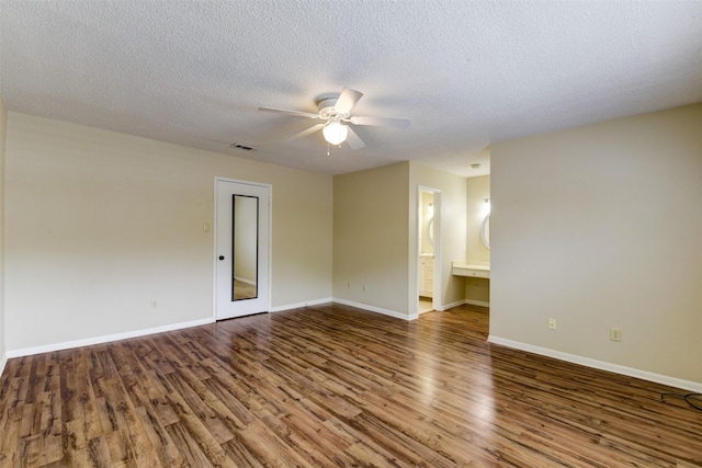 14436 Misty Meadow Ln, Houston, TX 77079 - unfurnished room with wood finished floors, a ceiling fan, and a textured ceiling
