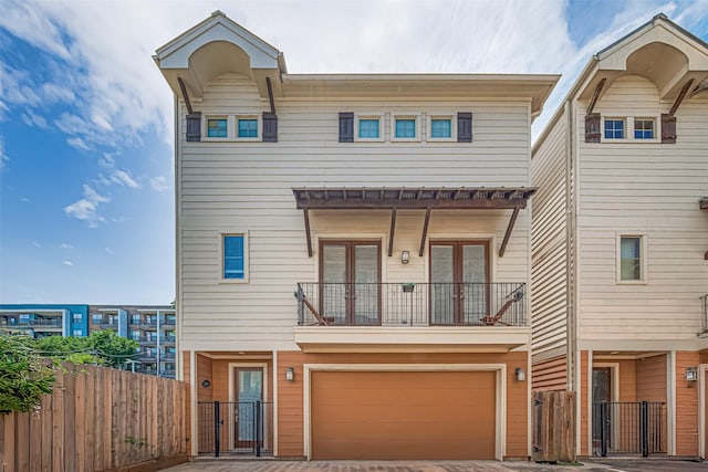 5307 Nett St Unit C, Houston, TX 77007 - townhome / multi-family property with a gate, a balcony, a garage, and driveway