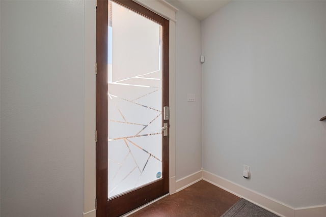 5307 Nett St Unit C, Houston, TX 77007 - doorway to outside with baseboards and concrete floors