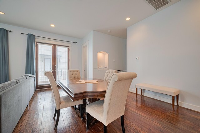 5307 Nett St Unit C, Houston, TX 77007 - dining room featuring dark wood-type flooring, arched walkways, recessed lighting, and french doors