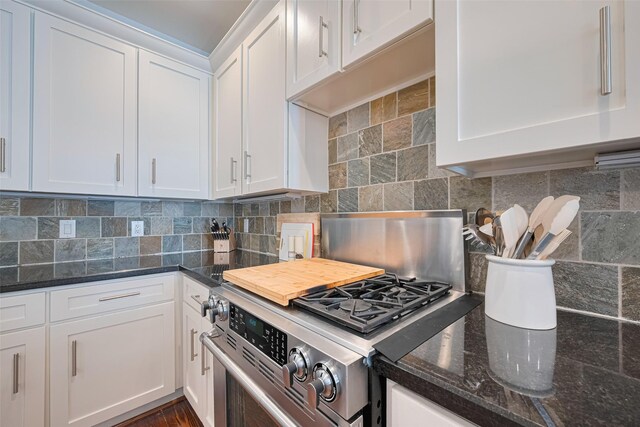 5307 Nett St Unit C, Houston, TX 77007 - kitchen featuring gas range, white cabinetry, and tasteful backsplash