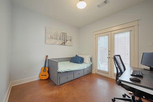 5307 Nett St Unit C, Houston, TX 77007 - bedroom with french doors, finished concrete floors, access to outside, and a desk