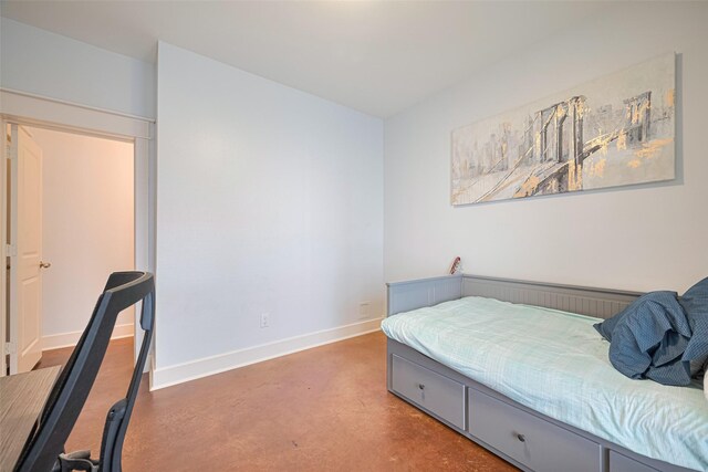 5307 Nett St Unit C, Houston, TX 77007 - bedroom featuring finished concrete flooring and baseboards