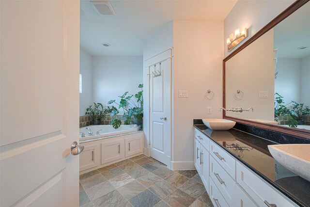 5307 Nett St Unit C, Houston, TX 77007 - bathroom with vanity, a bath, and stone finish floors