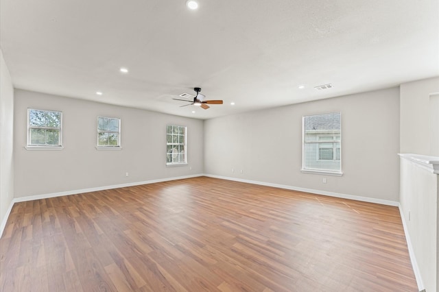 7347 Liberty Ridge Ln, Houston, TX 77049 - empty room featuring healthy amount of natural light, recessed lighting, light wood finished floors, and a ceiling fan