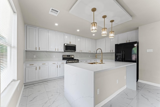 7347 Liberty Ridge Ln, Houston, TX 77049 - kitchen featuring appliances with stainless steel finishes, light marble finish flooring, recessed lighting, light countertops, and decorative light fixtures