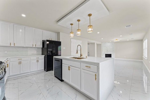 7347 Liberty Ridge Ln, Houston, TX 77049 - kitchen with black appliances, light marble finish floors, white cabinets, hanging light fixtures, and recessed lighting