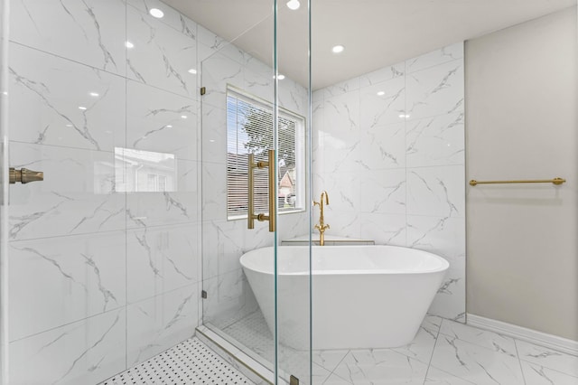 7347 Liberty Ridge Ln, Houston, TX 77049 - bathroom with a freestanding tub, marble finish flooring, a walk in shower, and recessed lighting