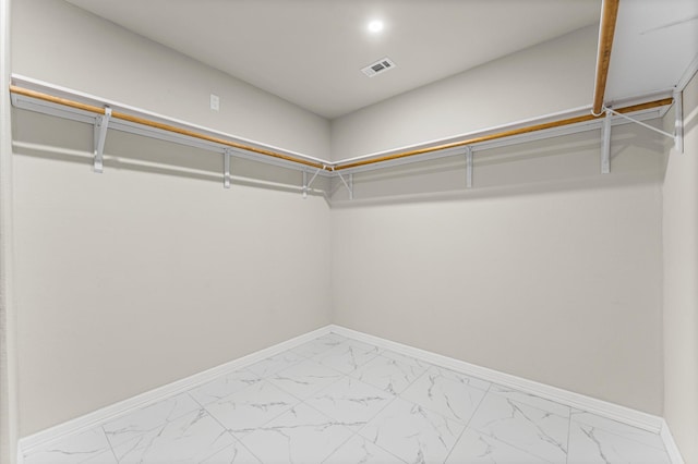 7347 Liberty Ridge Ln, Houston, TX 77049 - spacious closet featuring light marble finish flooring