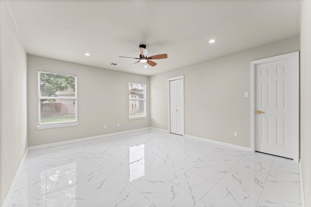 7347 Liberty Ridge Ln, Houston, TX 77049 - unfurnished bedroom featuring recessed lighting, light marble finish flooring, ceiling fan, and a closet