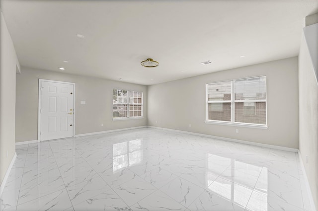 7347 Liberty Ridge Ln, Houston, TX 77049 - spare room with marble finish floors and recessed lighting