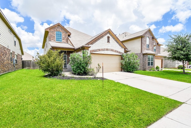 24914 Alberti Sonata Dr, Katy, TX 77493 - view of front of house featuring driveway, a garage, brick siding, and stone siding