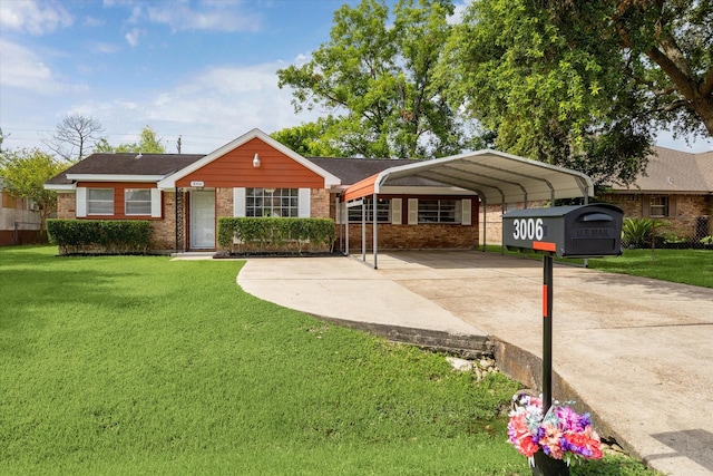 3006 Hartwick Rd, Houston, TX 77093 - ranch-style house with concrete driveway, a carport, brick siding, and a front yard
