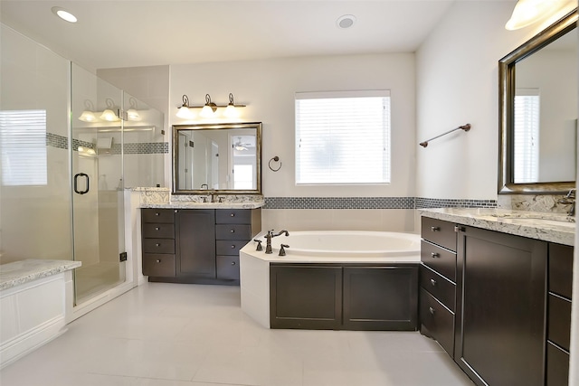 925 W 19th St Unit B, Houston, TX 77008 - bathroom with a shower stall, a bath, two vanities, tile patterned flooring, and recessed lighting