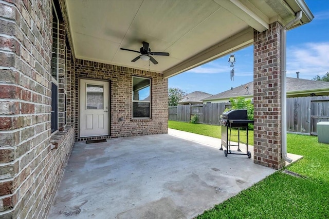 716 Saturnia Ln, League City, TX 77573 - fenced backyard featuring ceiling fan, a patio, and area for grilling