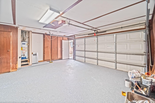 11826 Bandlon Dr, Houston, TX 77072 - garage with a garage door opener and gas water heater