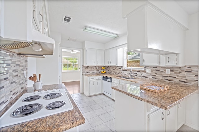 11826 Bandlon Dr, Houston, TX 77072 - kitchen with white appliances, tasteful backsplash, a peninsula, and white cabinets