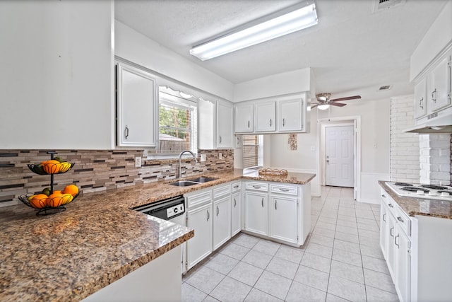 11826 Bandlon Dr, Houston, TX 77072 - kitchen featuring a peninsula, light tile patterned floors, under cabinet range hood, and white cabinetry