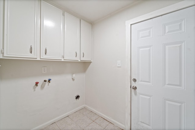 11826 Bandlon Dr, Houston, TX 77072 - laundry area with cabinet space, light tile patterned floors, and hookup for a washing machine