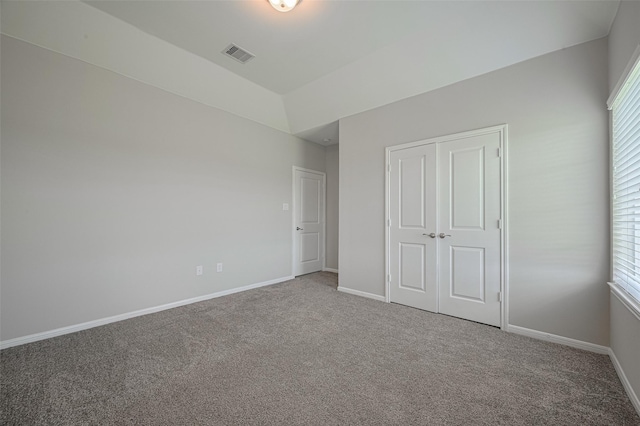 915 Lakeland Cir, Rosharon, TX 77583 - unfurnished bedroom with carpet flooring, multiple windows, and a closet