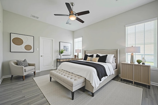 915 Lakeland Cir, Rosharon, TX 77583 - bedroom with multiple windows, wood finished floors, and a ceiling fan