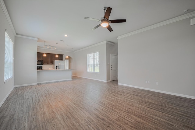 915 Lakeland Cir, Rosharon, TX 77583 - unfurnished living room featuring wood finished floors, crown molding, and ceiling fan