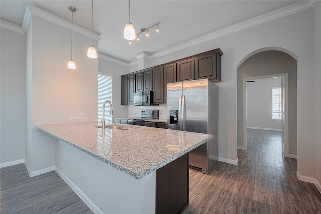 915 Lakeland Cir, Rosharon, TX 77583 - kitchen with stainless steel refrigerator with ice dispenser, electric stove, arched walkways, dark wood finished floors, and healthy amount of natural light
