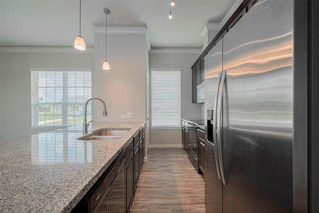 915 Lakeland Cir, Rosharon, TX 77583 - kitchen with stainless steel refrigerator with ice dispenser, dishwashing machine, light stone countertops, crown molding, and dark wood-style floors