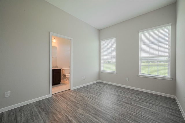 915 Lakeland Cir, Rosharon, TX 77583 - empty room with wood finished floors and baseboards
