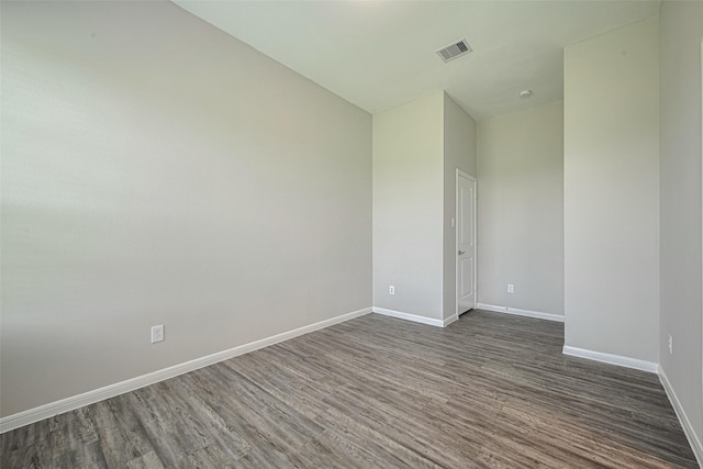 915 Lakeland Cir, Rosharon, TX 77583 - empty room with dark wood finished floors and baseboards